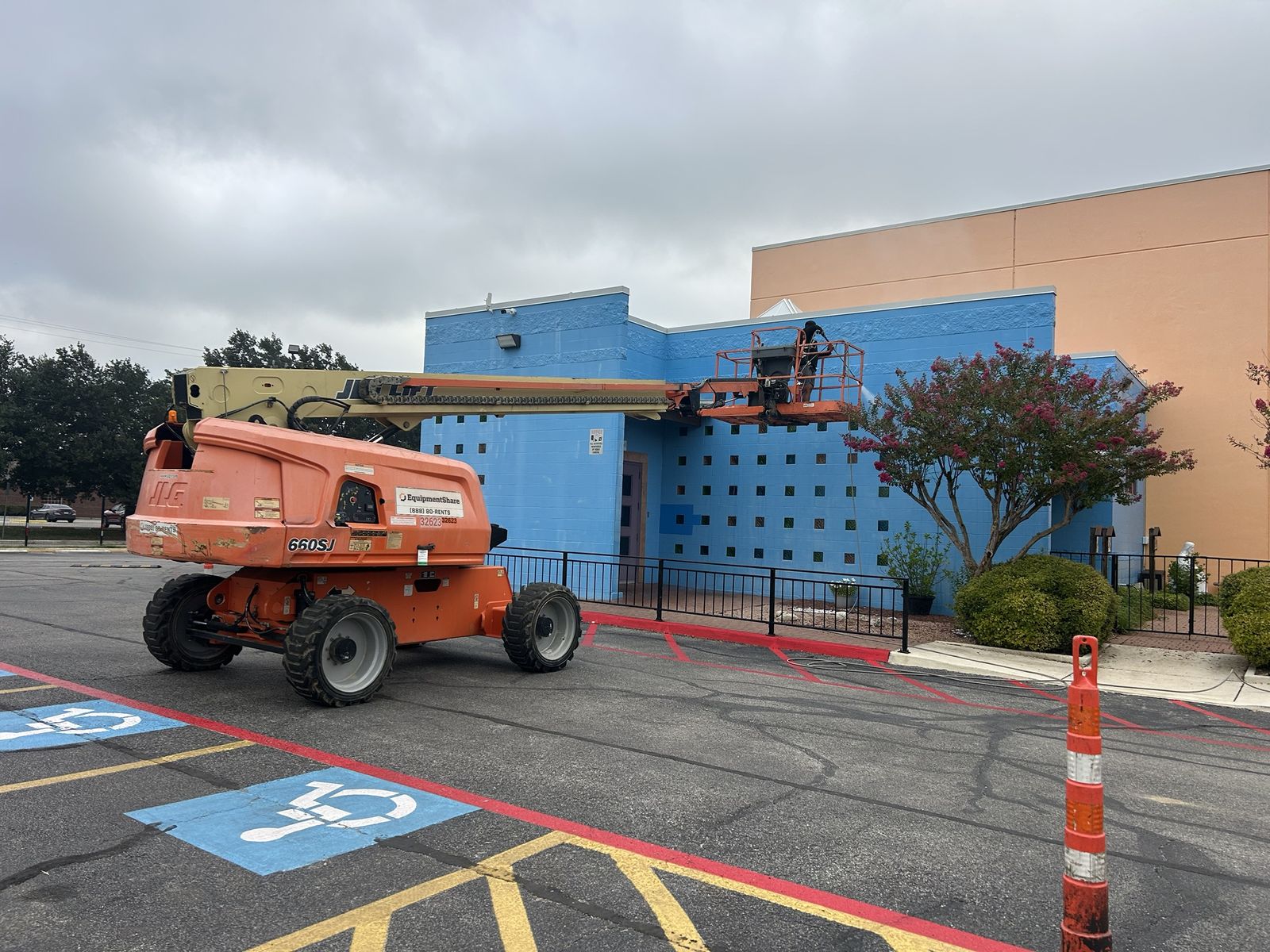 Washing the exterior walls of a commercial building from a boom lift